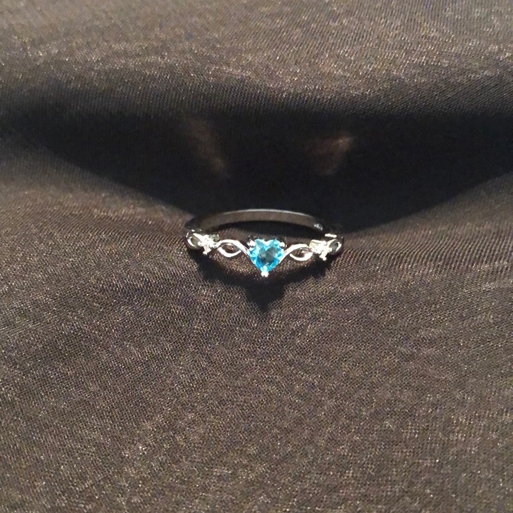 Described on purchase as Heart Shaped Sterling Silver Blue Topaz Ring